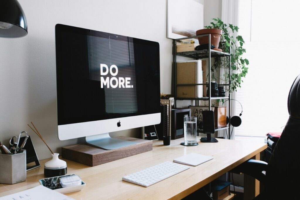 imac with wallpaper of "do more"