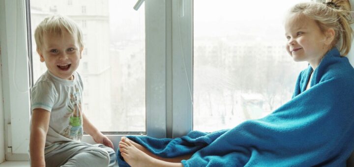 two children near to window